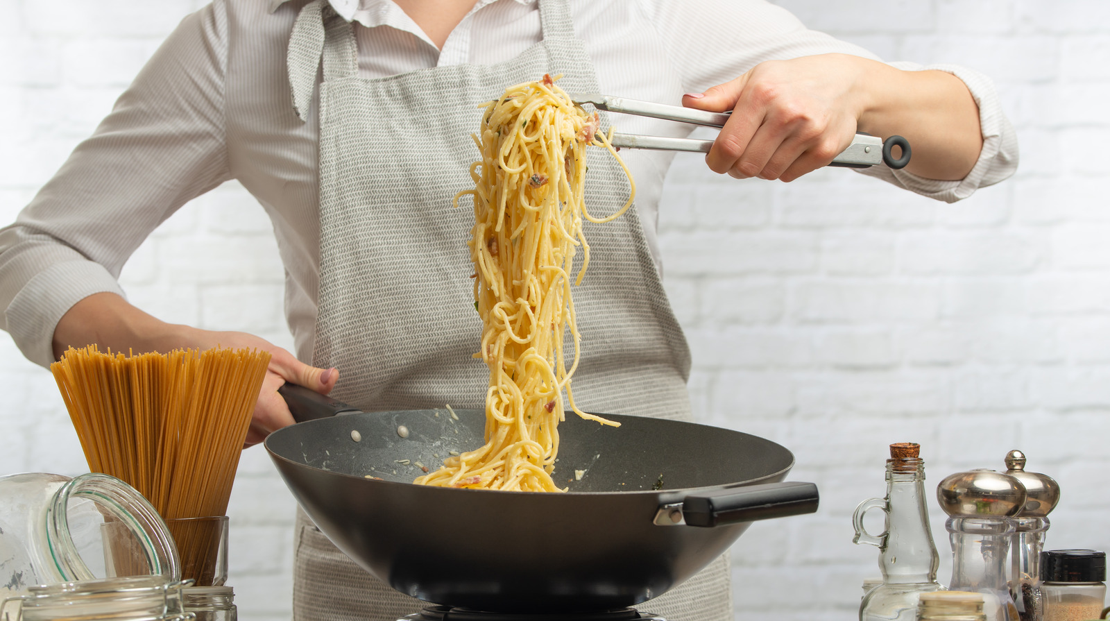 The,Chef,Pours,Boiled,Spaghetti,Into,Pan,Wok,For,Cooking